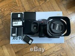 Canon XC10 Camcorder + 4 LP-E6 Batteries, Charger and original box/cables