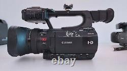Canon XF100 Full HD Camcorder With charger, battery and two CF Cards
