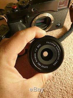 Fujifilm x-pro 1 with 18mm f2, box hood, 2 batteries, grip, charger and strap